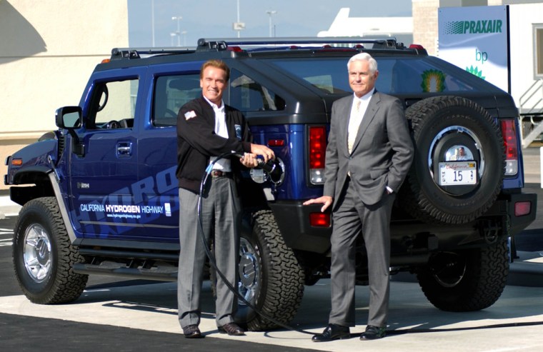 California Gov. Arnold Schwarzenegger, left, and GM Vice Chairman Bob Lutz fill up the first Hydrogen Hummer made as BP, PRAXAIR and Schwarzenegger dedicate the first retail-designed hydrogen fueling station for California at LAX in Los Angeles, Friday, Oct. 22, 2004. (AP Photo/Ann Johansson)