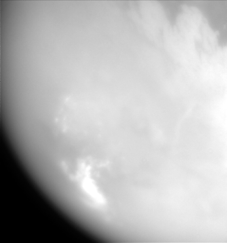 This image taken Tuesday, Oct. 26, 2004, by the spacecraft Cassini, is one of the closest ever of Saturn's hazy moon Titan. The image was captured by the spacecraft's imaging science subsystem as it flew by Titan. At its closest, Cassini was 1,200 kilometers (745 miles) above the moon, 300 times closer than during its first flyby on July 3, 2004. (AP Photo/NASA, JPL, Space Science Institute)