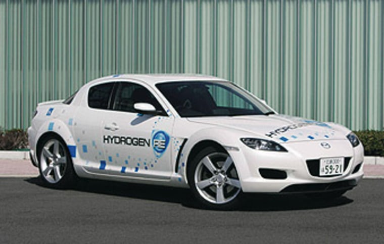 Mazda's H2RE vehicle is based on a RX-8 sports car and let's the driver switch between hydrogen or gasoline as the fuel.