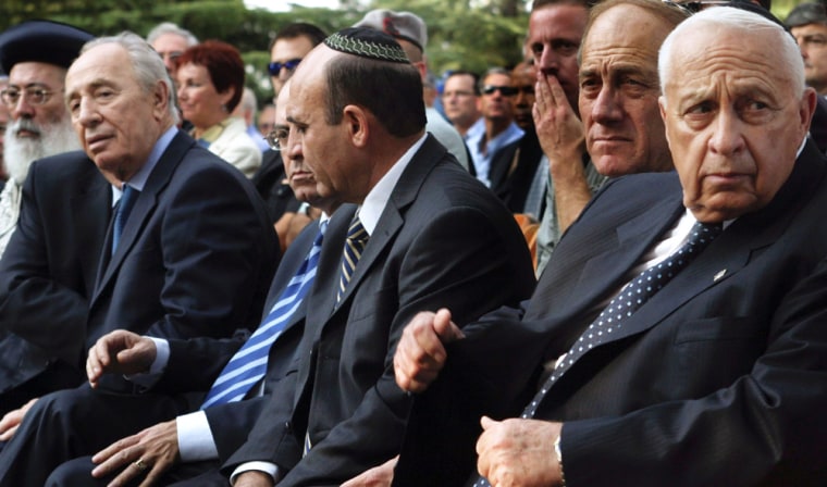 IIsraeli Prime Minister Ariel Sharon sits with cabinet ministers at Rabin memorial in Jerusalem