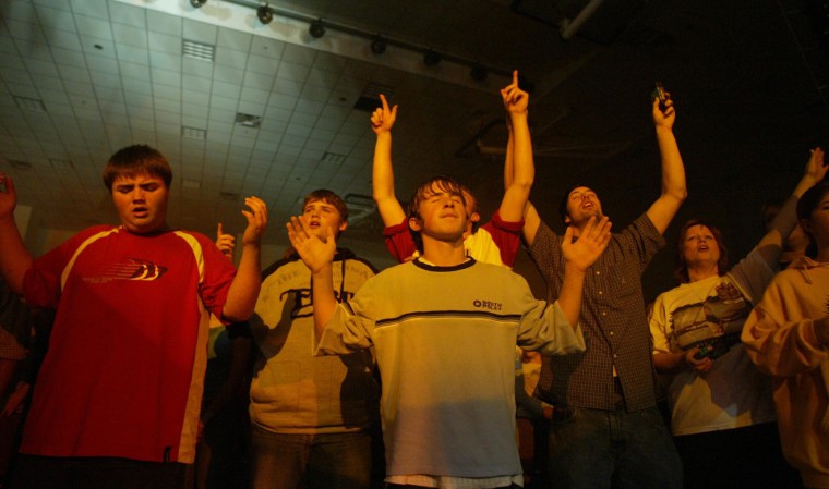 3. Audience members rejoice as Christian rock musician Jeremy Camp performs at the Gilead Friends Church as part of the Redeem the Vote tour Thursday, Oct. 21, 2004 in Mt. Gilead, Ohio. (Will Shilling/For The Washington Post)