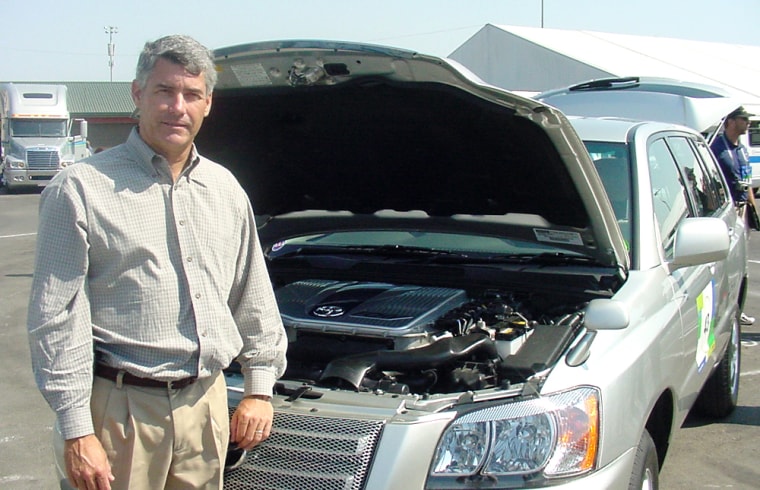 Gregg Kelly stands by the fuel cell Toyota Highlander that he’s been test driving for nearly two years.