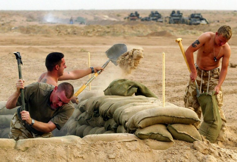 British soldiers from First Battalion The Black Watch dig in at Camp Dogwood near Baghdad