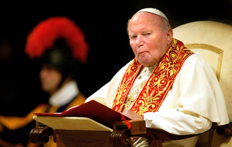 Pope John Paul II listens during the celebration of the Vespers in Saint Peter's Basilica at the Vatican