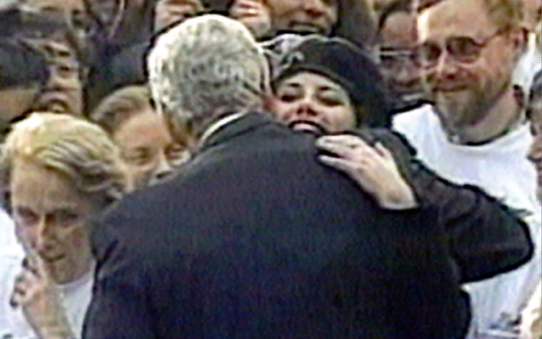 Monica Lewinsky embraces President Clinton as he greeted well-wishers at a White House lawn party in Washington on Nov. 6, 1996.