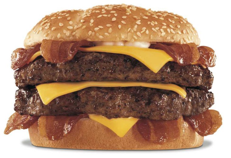 The "Monster Thickburger" — two 1/3-pound slabs of Angus beef, four strips of bacon, three slices of cheese and mayonnaise on a buttered sesame seed bun — sells alone for $5.49, $7.09 with fries and a soda.