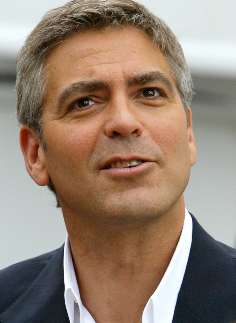 U.S. ACTOR GEORGE CLOONEY SIGNS AUTOGRAPHS ON THE SET OF 'OCEANS 12' IN ROME