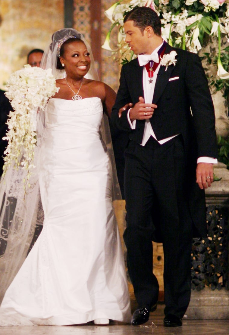 Star Jones, co-host of ABC's \"The View,\" and banker Al Reynolds walk down the aisle at their wedding in New York Saturday, Nov.  13, 2004. (AP Photo/Charles Maring/Maring Photography)