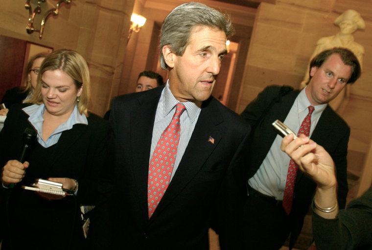 Sen. John Kerry talks with reporters on the way to his office.