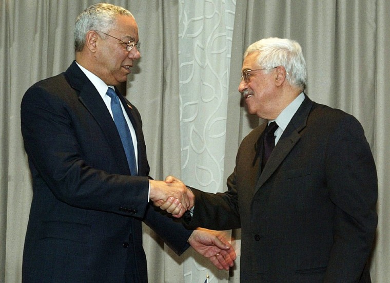 US Secretary of State Powell shakes hands with PLO chief Mahmoud Abbas in Jericho