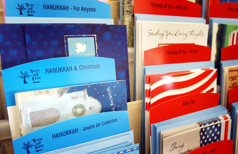 Blended holiday cards for Hanukkah and Christmas are on display at Rod's Hallmark store in Lawrence, Kan.