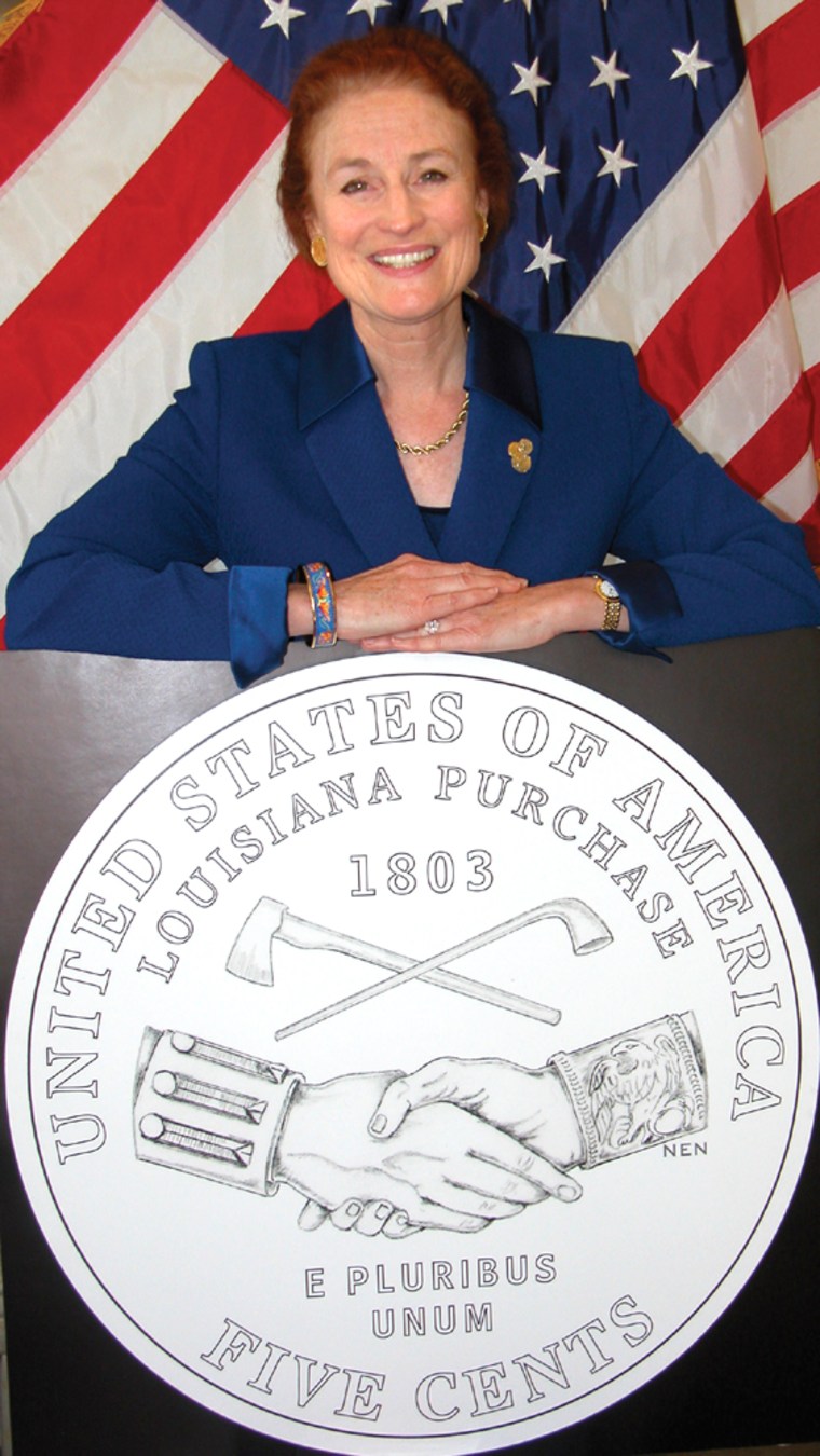 U.S. Mint Director Henrietta Holsman Fore with an image of the Peace Medal nickel, the first of the Westward Journey series. 