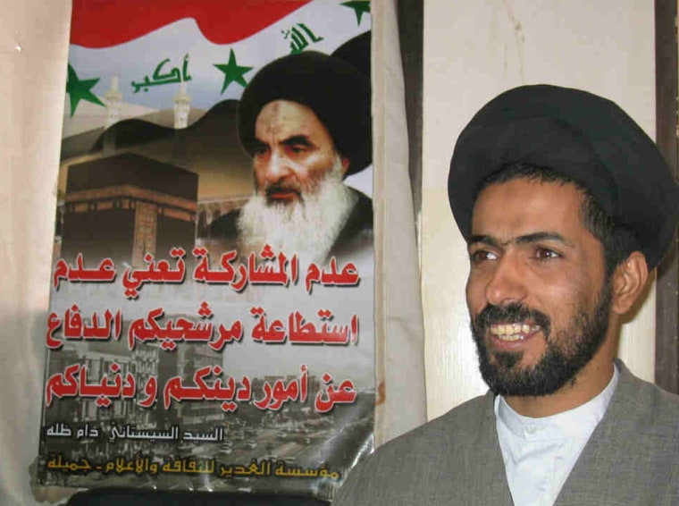 Sayyid Hashem Awadi stands in front of a poster of Grand Ayatollah Ali Sistani, Iraq's preeminent religious figure who wields great influence over Shiite involvement in the upcoming election.