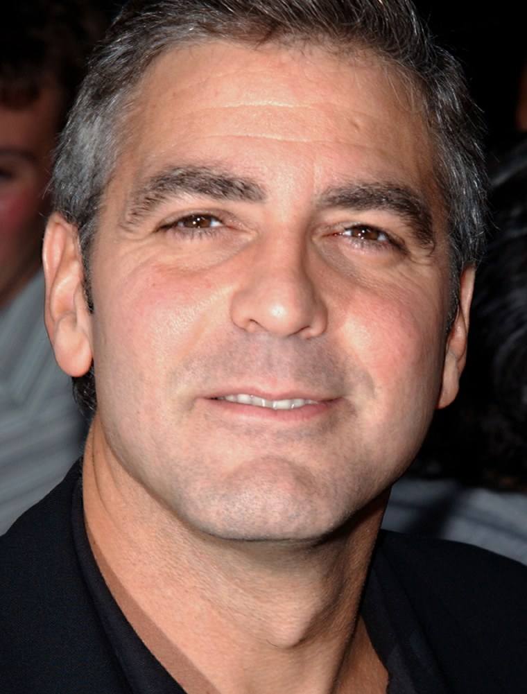 ** FILE  ** Actor George Clooney arrives to the premiere of the film \"Intolerable Cruelty\" at The Academy Theatre, in this Sept. 30, 2003, in Beverly Hills, Calif. Clooney is suffering from a ruptured disk that kept him promoting his new film, \"Ocean's Twelve,\" this week. (AP Photo/ Paul Skipper, File)