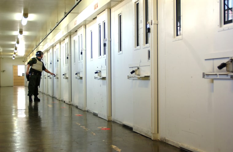 Guard checks doors at San Quentin prison
