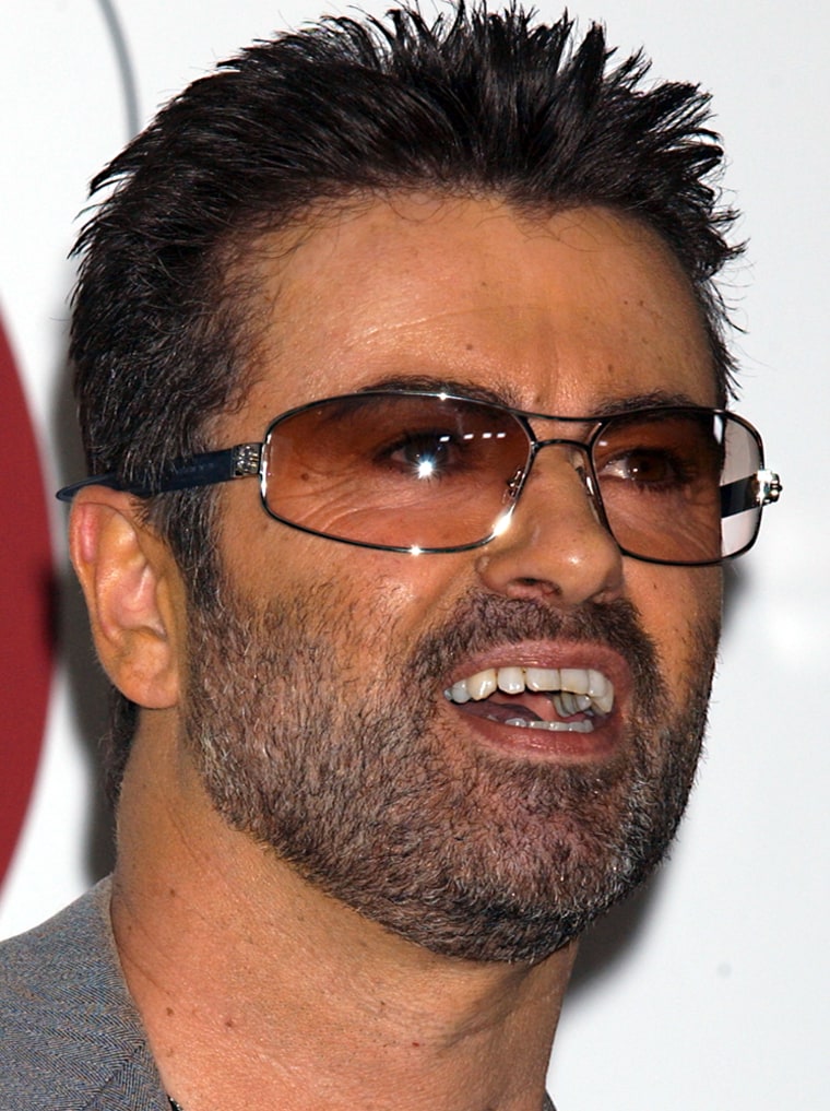 ** FILE ** George Michael is shown at an in-store appearance held at the Virgin Megastore in Los Angeles, Calif., in a file photo from May 21, 2004.  British police are searching for a woman suspected of breaking into pop star Michael's home. (AP Photo/Luis Martinez, File)