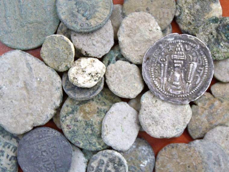 Ancient coins are displayed after their recovery from grave looters in Jerusalem