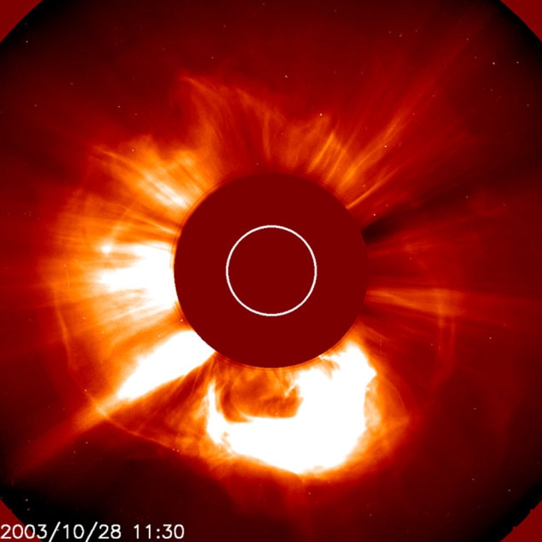 The coronal mass ejection of Oct. 28, 2003, associated with a huge solar flare, shows up as a bright expanding ring around the sun. Horizontal strikes are caused by saturation of the spacecraft's imager. 