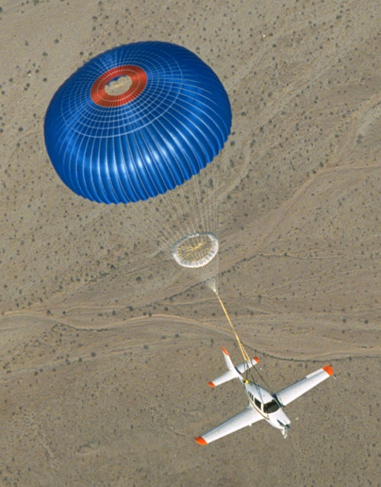 In this undated photo made available by Ballistic Recovery System, Inc., an emergency parachute system is deployed on a small private plane. 