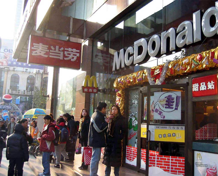 On Shanghai's Huai Hai Central Road, shoppers flock to McDonald's as more and more Chinese embrace fast food.