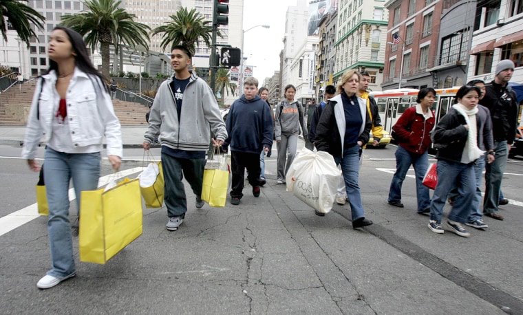 Post-holiday shoppers, like these pictured Sunday in San Francisco, are giving retailers reason to hope that they will meet their modest sales outlooks.