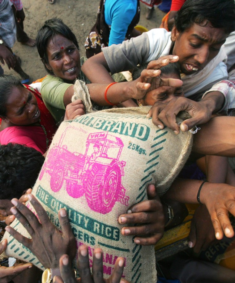 Survivors of tsunami struggle to get hold of rice bags in Cuddalore