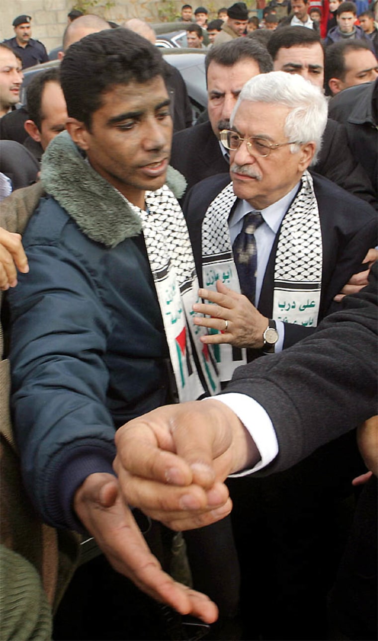 Palestinian presidential candidate Abbas meets commander of al Aqsa Martyrs Brigades Zubeidi