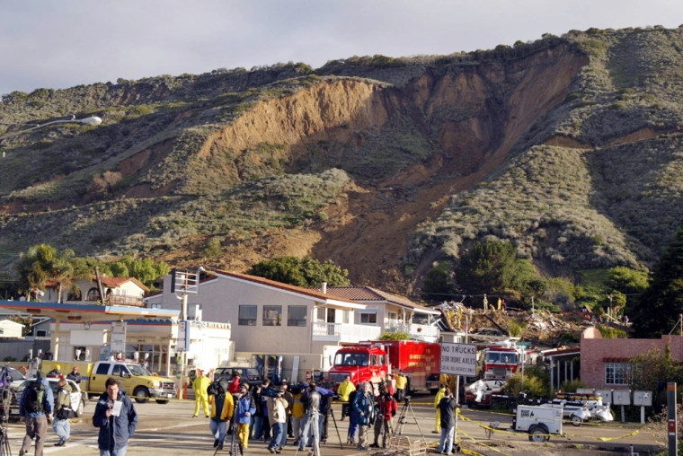 Television crews, foreground, gather Tuesday in La Conchita, Calif., where this hillside collapsed onto the small coastal community. 