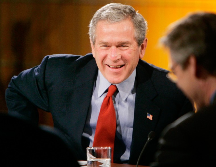 US President Bush laughs during White House Economic Conference in Washington