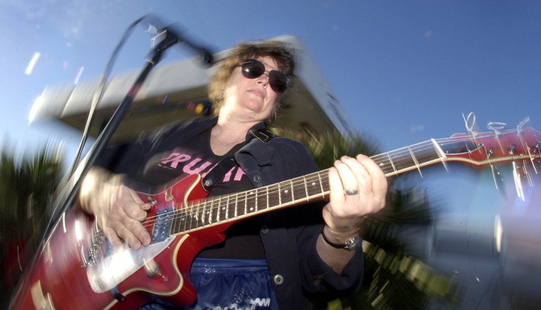 Frances Peterson plays lead guitar for the all women band Frump during a performance in Dallas, Sunday, Dec. 12, 2004. Frump is still trying to forge an identity, teetering between being a novelty and a serious band. (AP Photo/L.M. Otero)