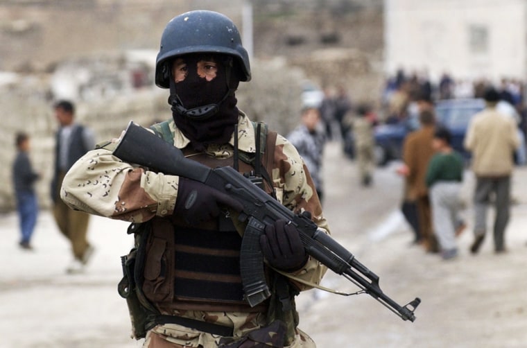 An Iraqi National Guard soldier patrols in Mosul, Iraq, Sunday, Jan. 23, 2005. U.S. and Iraqi officials fear a spike in bloodshed and have announced massive security measures to protect voters from possible insurgent attacks during the elections. (AP Photo/Jim MacMillan)