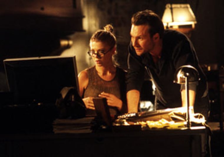 Tara Reid and Christian Slater in Lions Gate Films' Alone in the Dark - 2005