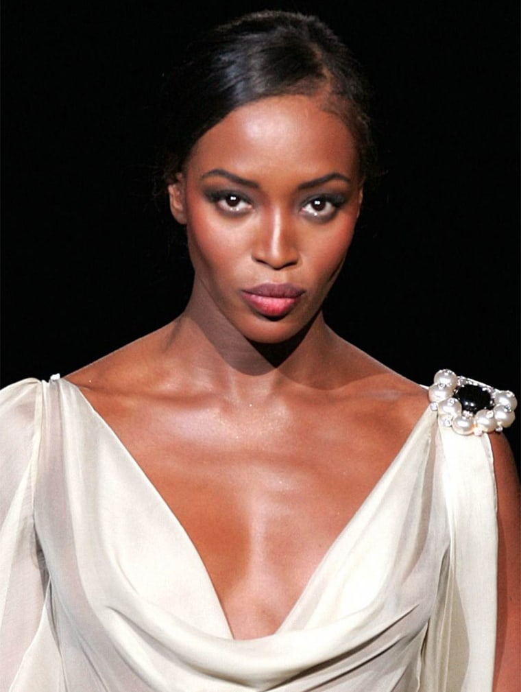 British top model Naomi Campbell presents a creation for Italian designer Valentino's  fashion show in Paris