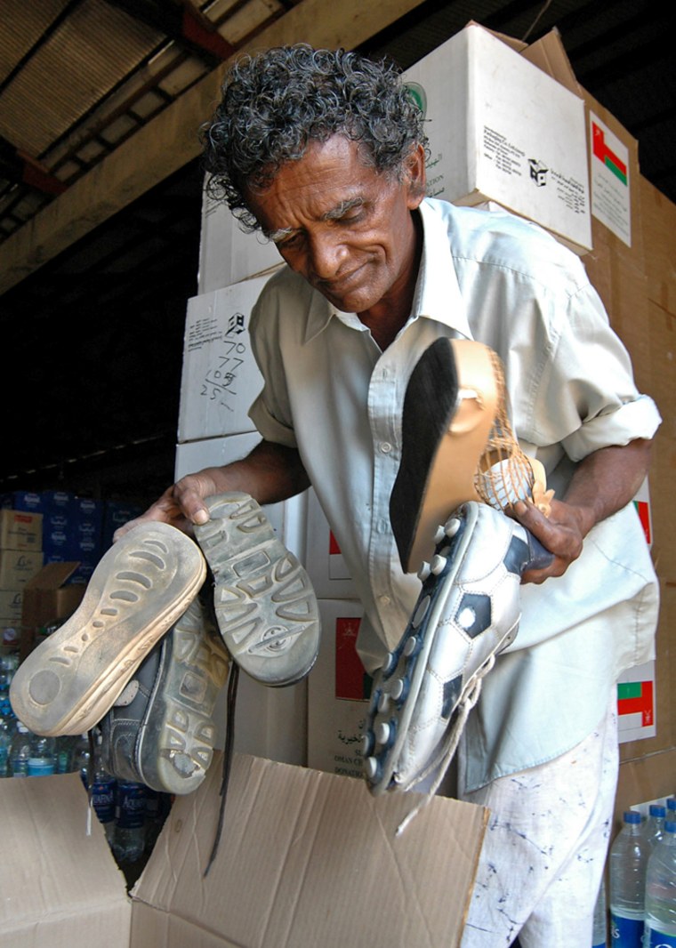 In a country where most people wear flip-flops or sandals, some boxes of aid contained used shoes, including soccer cleats, boots and silver evening shoes with 4-inch heels.