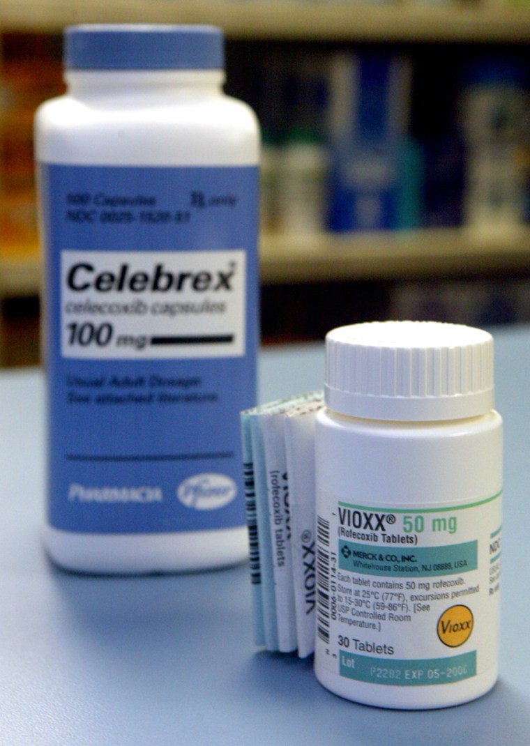 A bottle of Vioxx, right, sits next to a bottle of Celebrex at a pharmacy in New York on Sept. 30. The two painkillers belong to a class of drugs called COX-2 inhibitors, which have been linked to heart attacks.