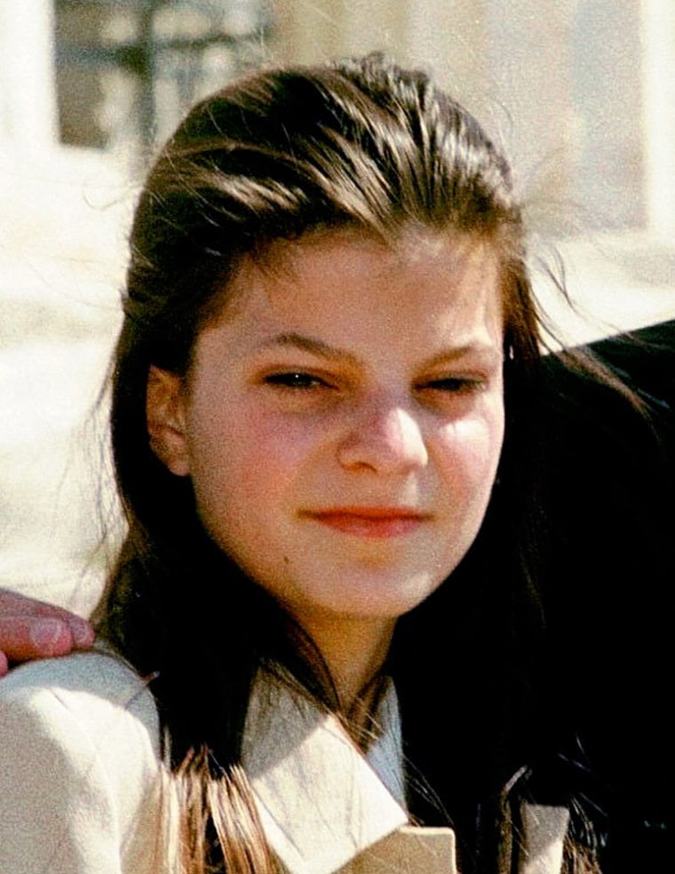 **FILE ** Athina Roussel, the 13-year-old grandaughter of the late shipping tycoon Aristotle Onassis, stands with her father Thierry Roussel on Athens' Acropolis hill in this March 22, 1998 file photo. Athina Roussel , one of the last descendants of a tormented family,  reaches the inheritance age of 18 Wednesday, Jan. 29, 2003, takes on a difficult role along with her great wealth. (AP Photo/Dimitri Messinis)