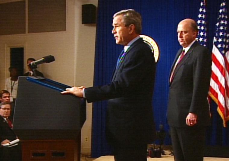President Bush announces his choice of John Negroponte, right, as the new national intelligence director Thursday.