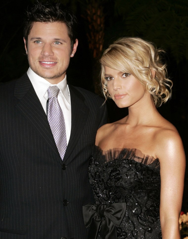 Singers Nick Lachey and Jessica Simpson pose as they arrive for the Clive Davis pre-Grammy party in Beverly Hills
