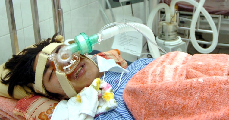 Infected bird flu virus patient Nguyen Sy Tuan lies in Vietnam's National Institute for Tropical Diseases in Hanoi