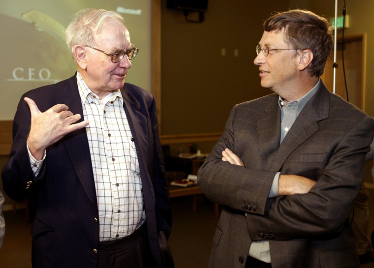 The gap between the world’s two richest people, Bill Gates (right) and Warren Buffett, narrowed further this year.