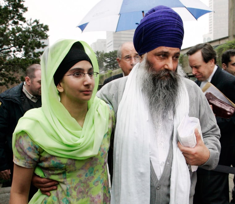 Sikh activists Ajaib Singh Bagri walks with his daughter after being cleared in the Air India bombing