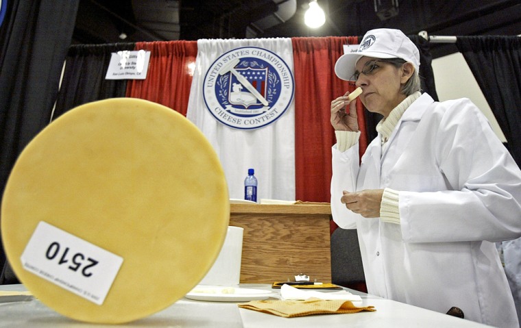 Judy Capparelli of Smithfield, Utah, smells a sample of cheese at this week's U.S. Championship Cheese Contest.