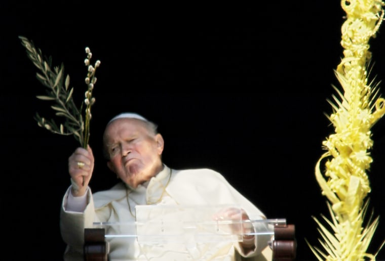 Pope John Paul II appears at a window overlooking St. Peter's Square at the Vatican on Sunday. The ailing pontiff was unable to preside over Palm Sunday Mass for the first time in his 26-year papacy.