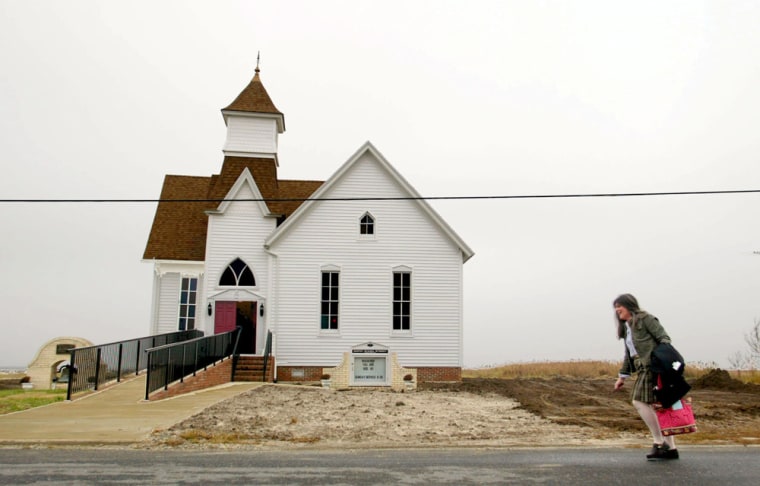 Hoopersville United Methodist Church organist Teena Gorrow walks to services Sunday Nov. 21, 2004. (AP Photo/ Matt Houston)