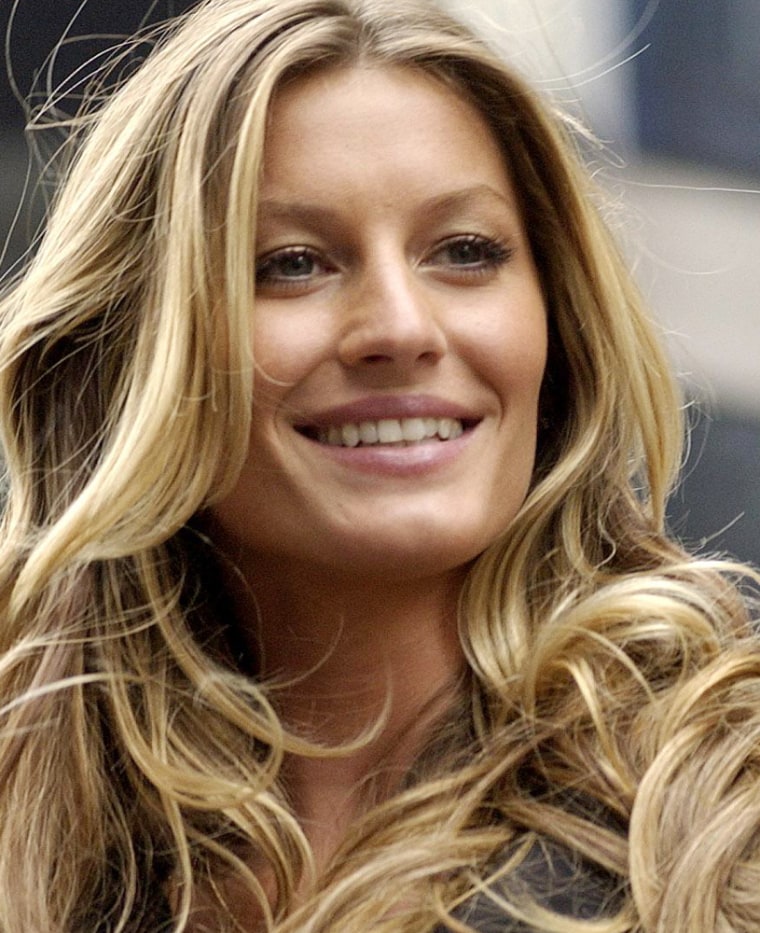 Fashion model Gisele Bundchen smiles promotes a new brassiere in New York