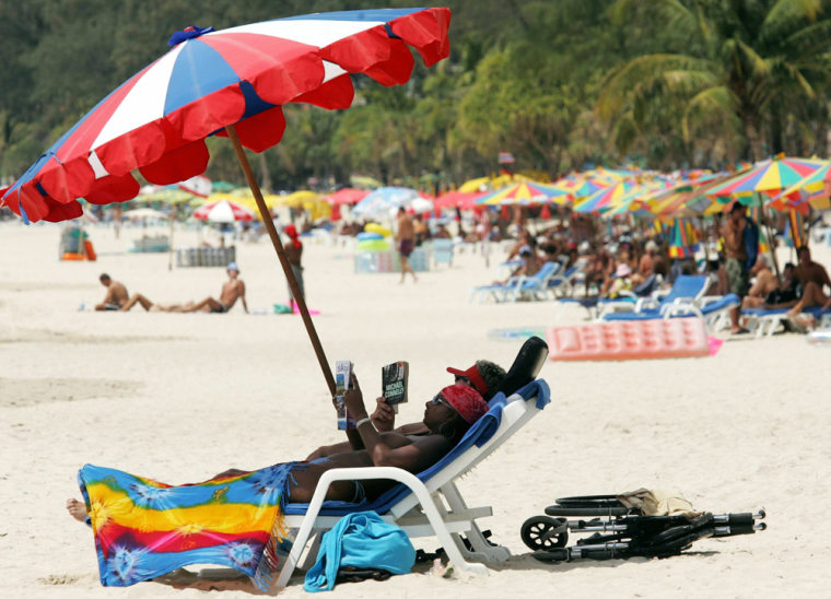 Foreign tourists take sun bath at Patong