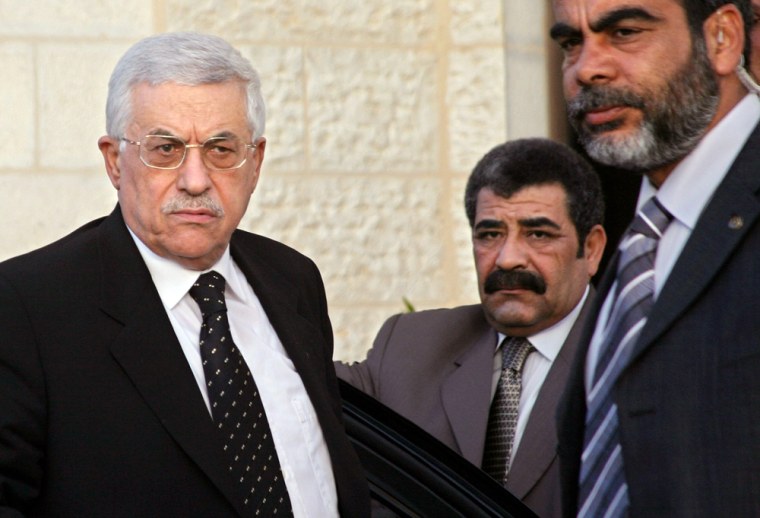 Palestinian President Mahmoud Abbas arrives at his headquarters in the West Bank city of Ramallah