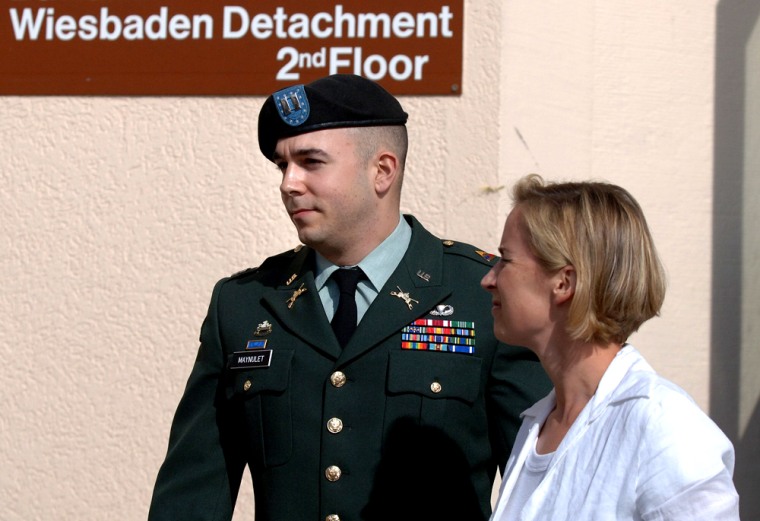 U.S. Army Capt. Rogelio M. Maynulet, left, and his wife Brooke are seen at the courthouse at the Army Airfield in Wiesbaden, near Frankfurt, Germany, on Tuesday.