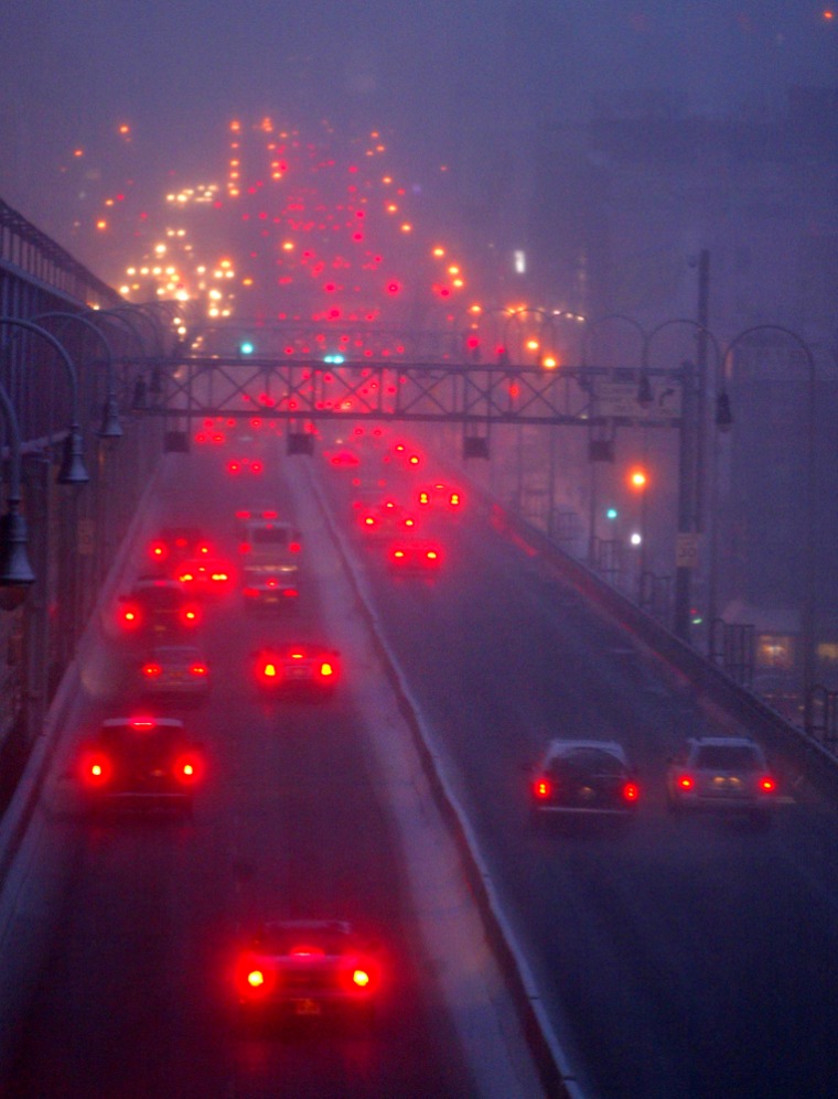Traffic flows into Manhattan over the Williamsburg Bridge during a rush-hour snowstorm on Feb. 28. The average commute for New Yorkers is 38 minutes, according to the Census report.
