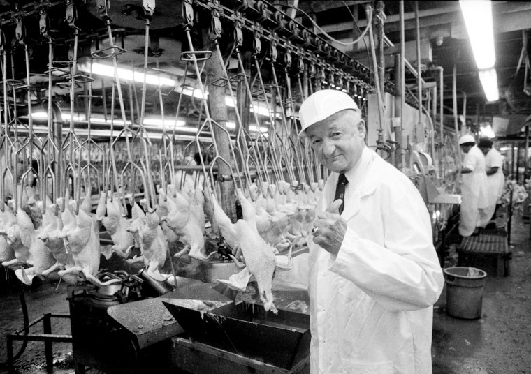 Frank Perdue gives a thumbs up to the freshly plucked chickens travelling the production line in his Salisbury, Md. plant, in this photo taken in 1984. 